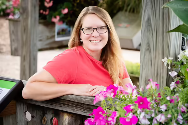 Woman poses in garden
