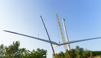 Wind turbine blades being lowered to the ground