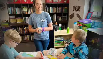 Teen teacher working with students
