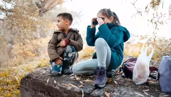 A boy and girl exploring in Nature 