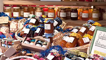 Jars of preserves are displayed inside a store