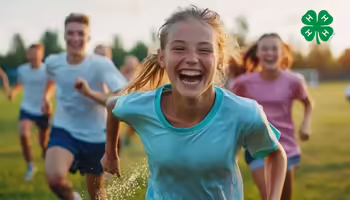 Youth running outside. A green 4-H clover in the upper right corner.