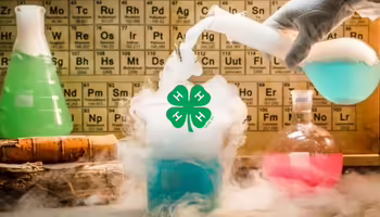 A science-themed graphic with a 4-H logo in a beaker that is smoking. The background shows beakers of colored liquid and a periodic table.