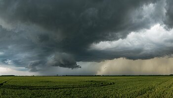 Thunderstorm gathering over fields