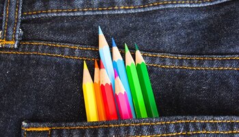 Color pencils in jean pocket