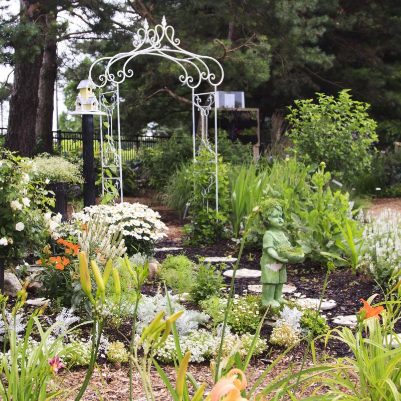 Garden with lots of flowers and arbor 