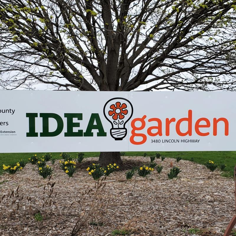 white Idea Garden sign with green and orange writing