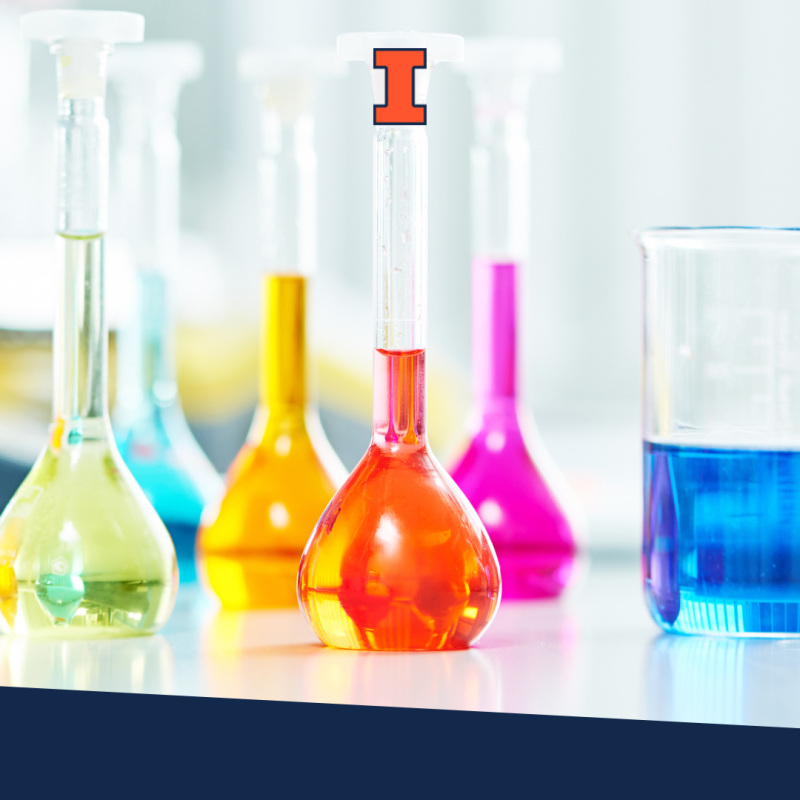 Lab beakers with different colors of chemicals in them. 