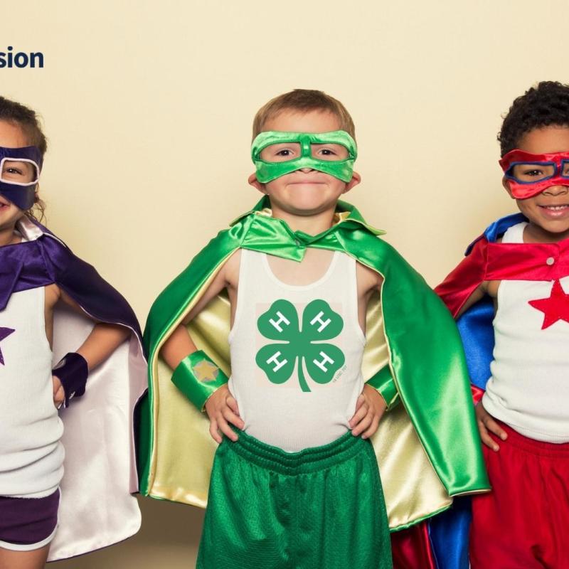 young children dressed as superheroes