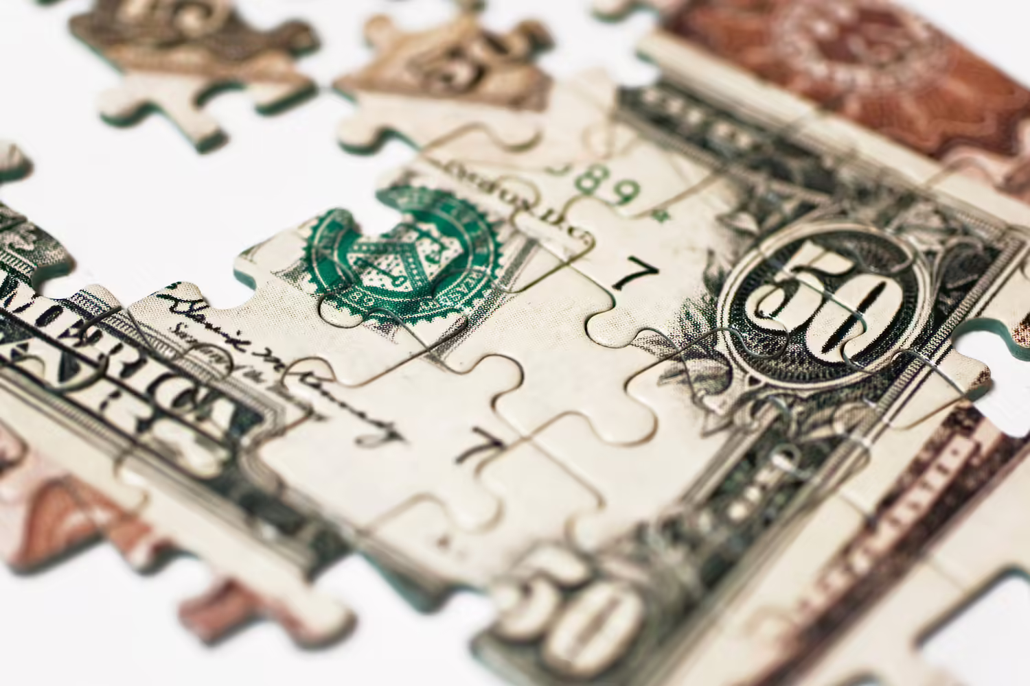 A puzzle of a $50 bill