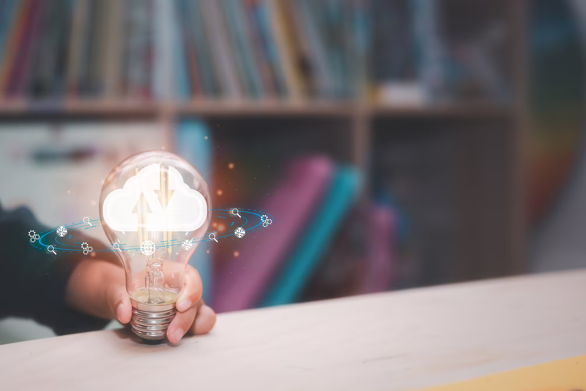 lit lightbulb with search and technology icons around it