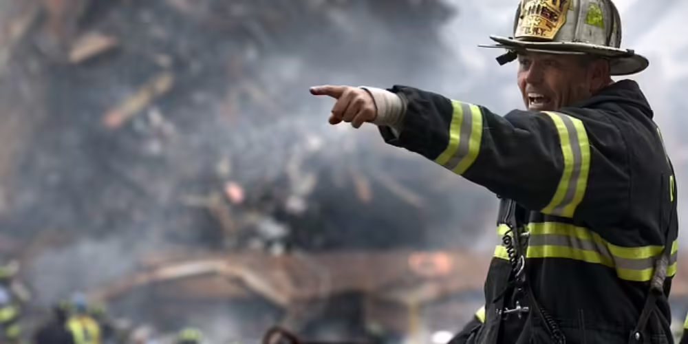 Fireman pointing a warning during a disaster