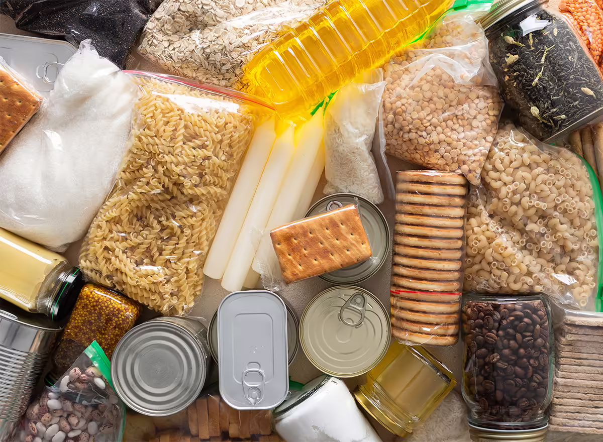 shelf-stable food includes packages of lentils, pasta, crackers, and beans, canned meats, and bottled cooking oils.