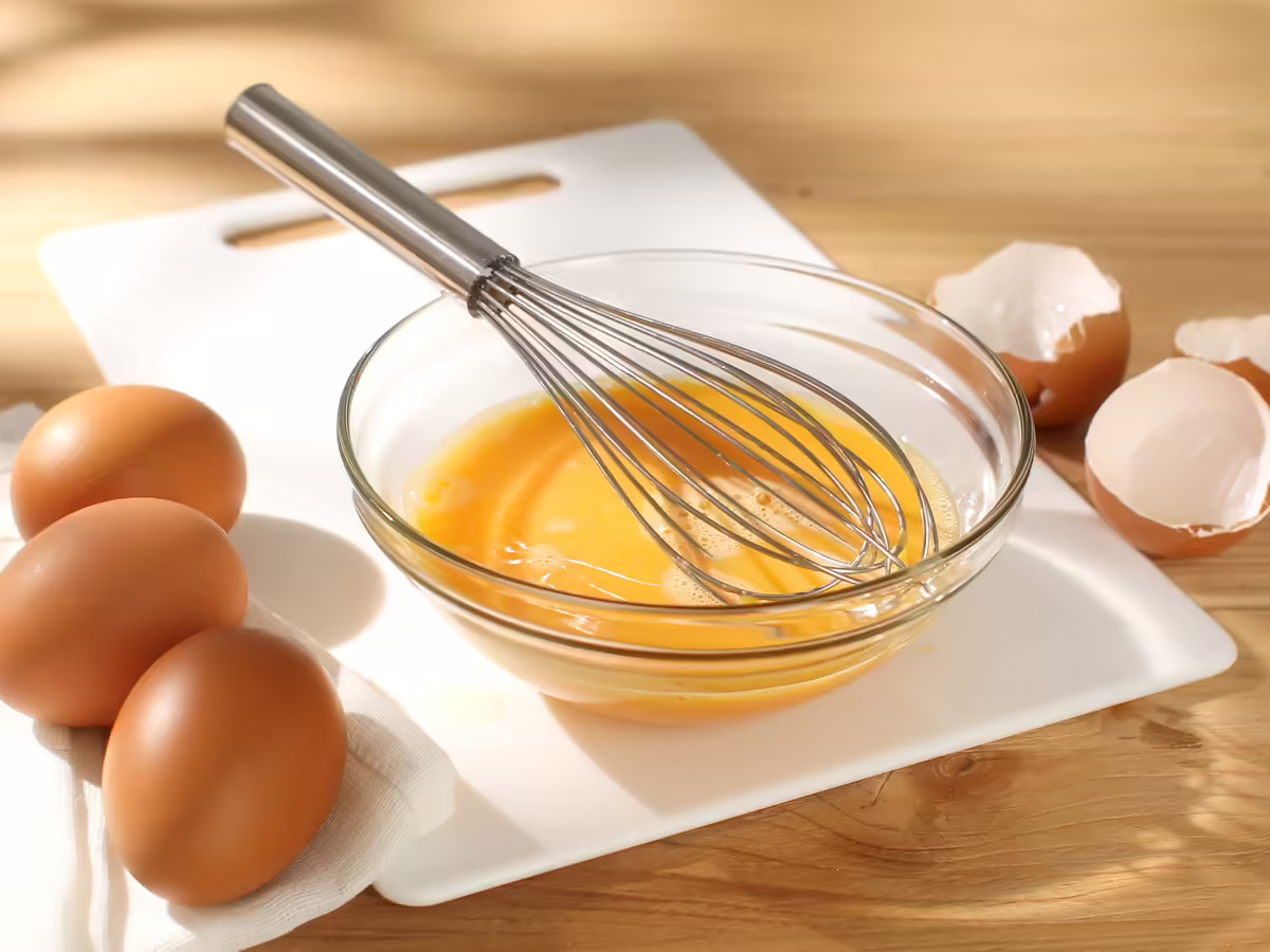 whisked eggs in a clear bowl