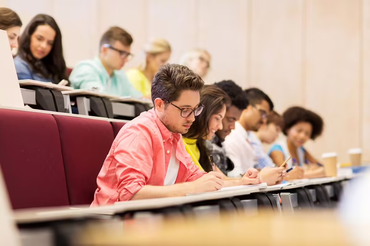students in a classroom taking notes