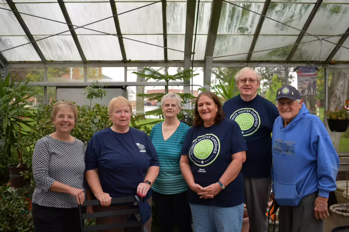 Master Gardeners in a greenhouse