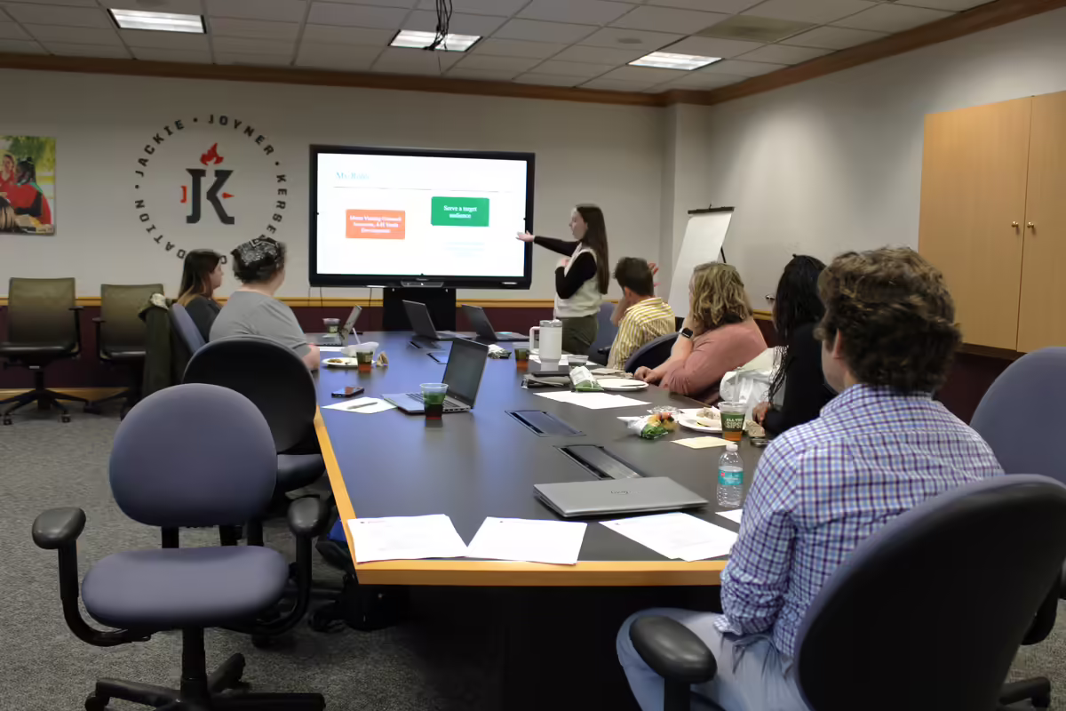Extension staff with Extension Council members in a meeting at the JJK FAN Center.