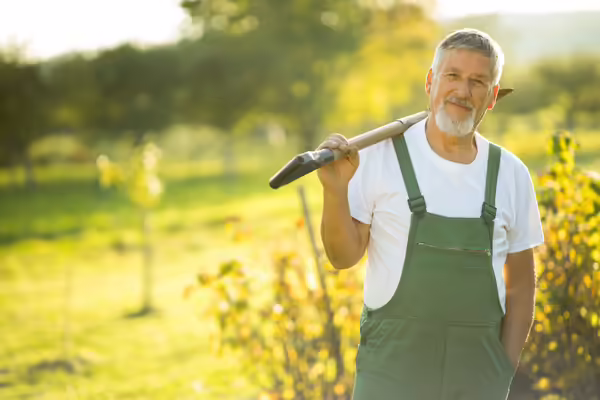 A man holding a shovel