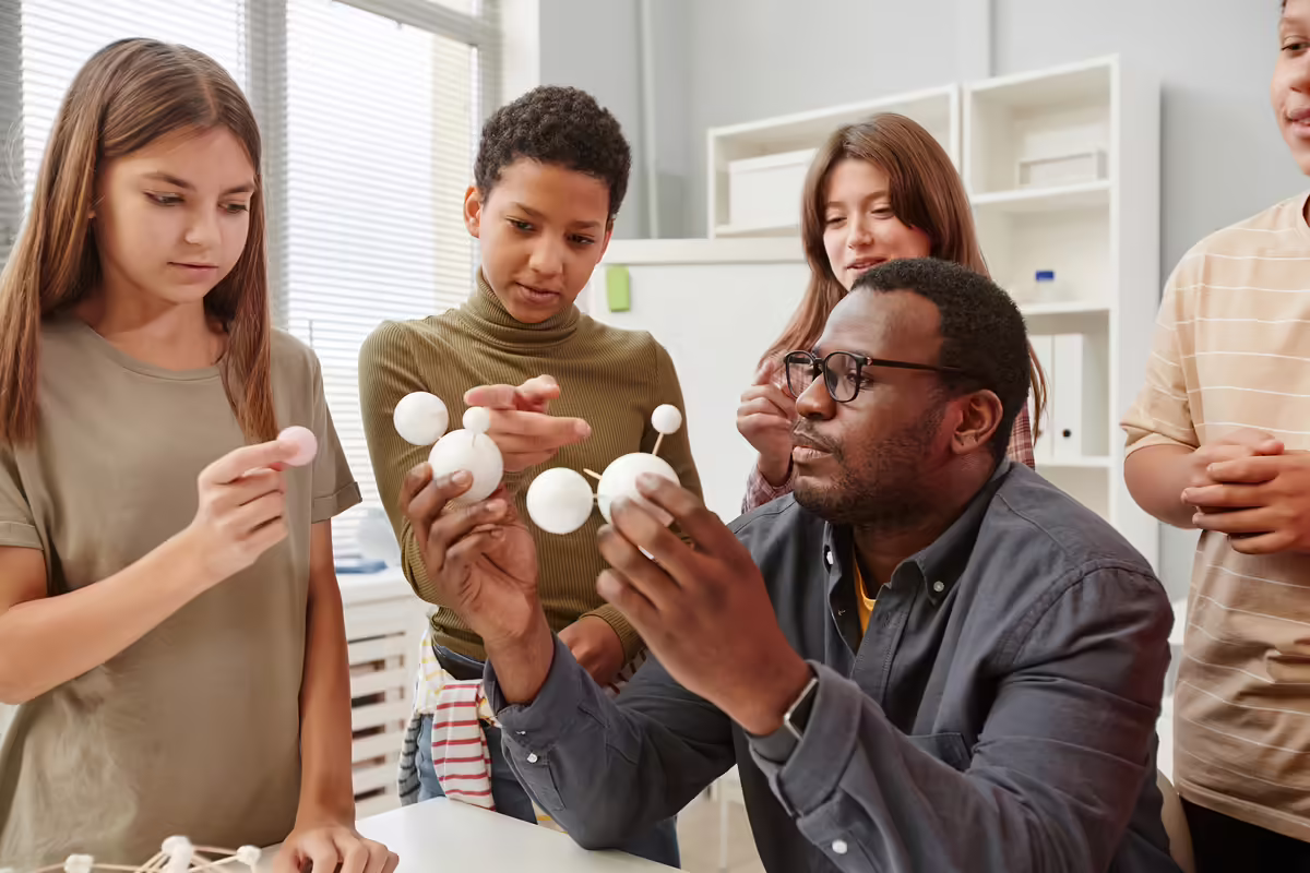 Adult teaching youth STEM