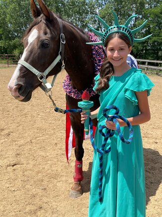 girl with horse in liberty costume