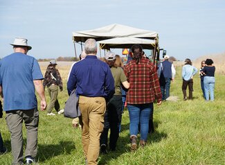 People walking on a farm tour
