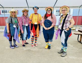 adults dressed in clown costume