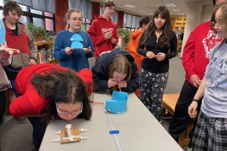 students test their skill at racing wind powered cars