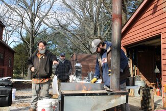 A man demonstrates part of the maple syrup making process