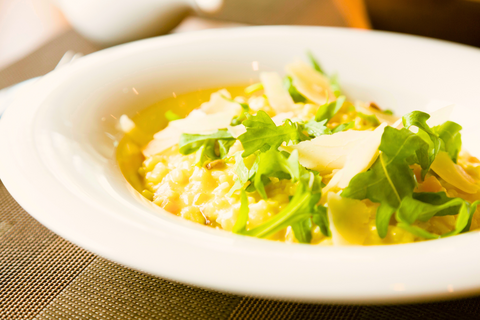 Bowl of risotto with arugula