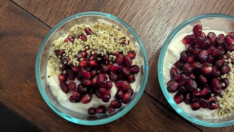  A bowl of pomegranate and hemp hearts topping yogurt.