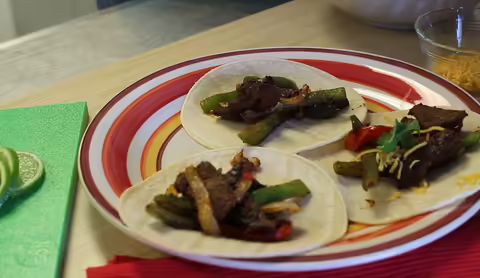 Three venison fajitas on a plate