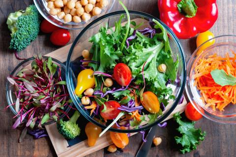 Colorful overhead photo of salad with mixed greens and vegetables