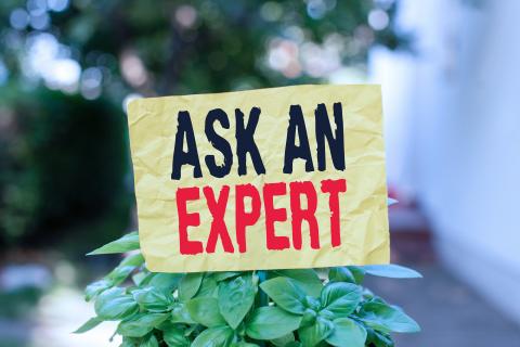 A sign with text that reads "ask an expert"