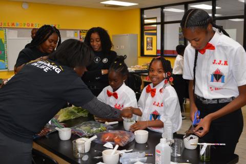 Youth at Jackie Joyner Kersee Center doing science experiments