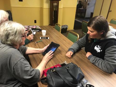 Digital Ambassador, Kelsey Laird, helped participant, Karen, with her tablet issue. 