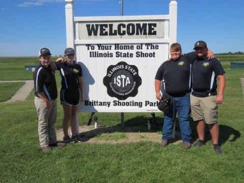 4-Hers standing in front of large sign for Brittany Shooting Park