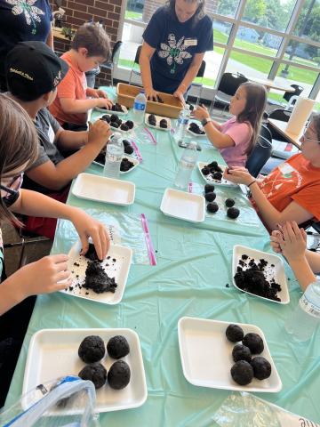 Participants make seed bombs during the Pollinator Celebration""