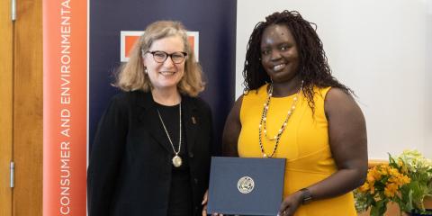 Anne Silvis, Extension's community and economic development assistant dean stands with Susan Ogwal, U of I alumna and former Illini Science Policy Scholar, at a May 2022 ceremony honoring Ogwal's ISPP cohort.