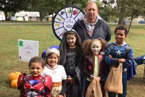 children in costumes learning about vegetables