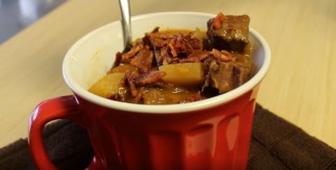 Venison and vegetable stew in mug