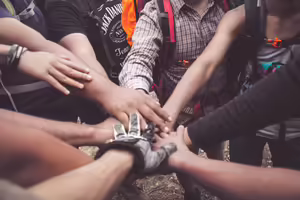 hands in team circle