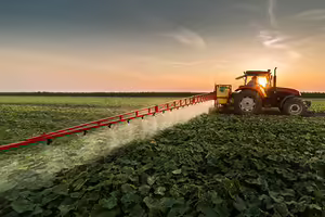 tractor spraying insecticide and pesticide