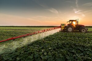 tractor spraying insecticide and pesticide