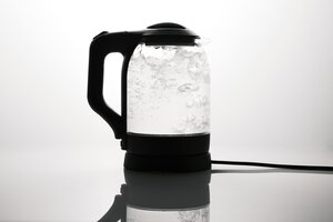 glass tea kettle with boiling water