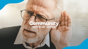 older man with hand cupped around ear