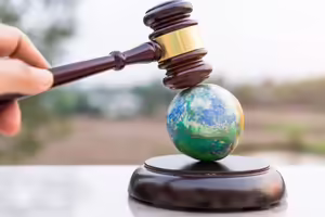 a gavel on top of a model of the earth
