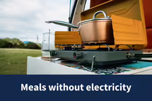 cooking pot on top of a camping stove outside