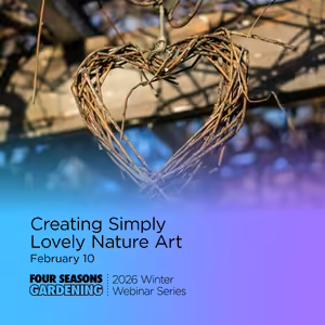 A heart design made from willow branches hanging outdoors for decor