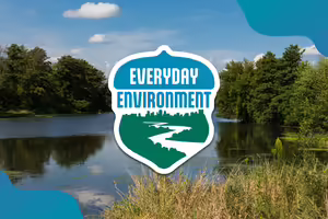 Logo on top of photo of a lake