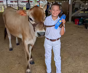 youth with dairy cow